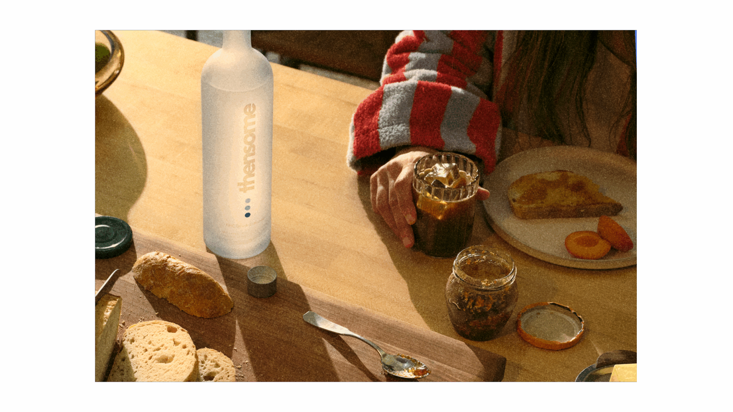 Woman drinking Thensome at the breakfast bar.