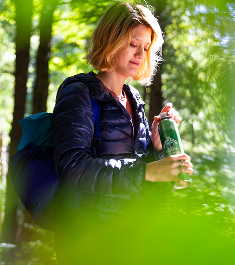 Woman opening water bottle