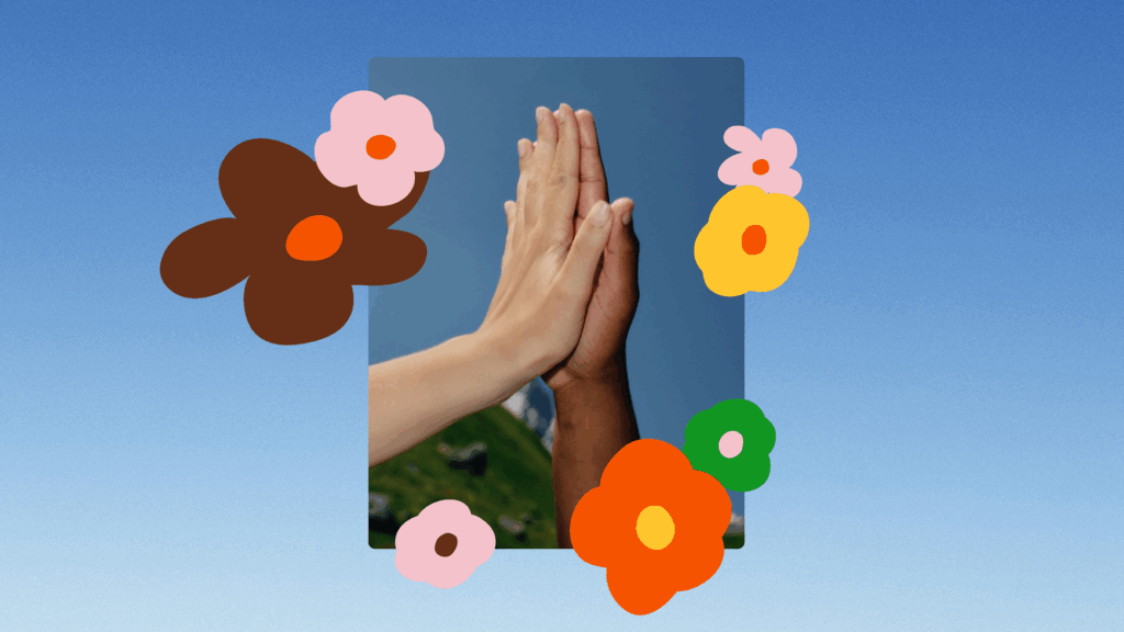 To hands together surrounded by flowers