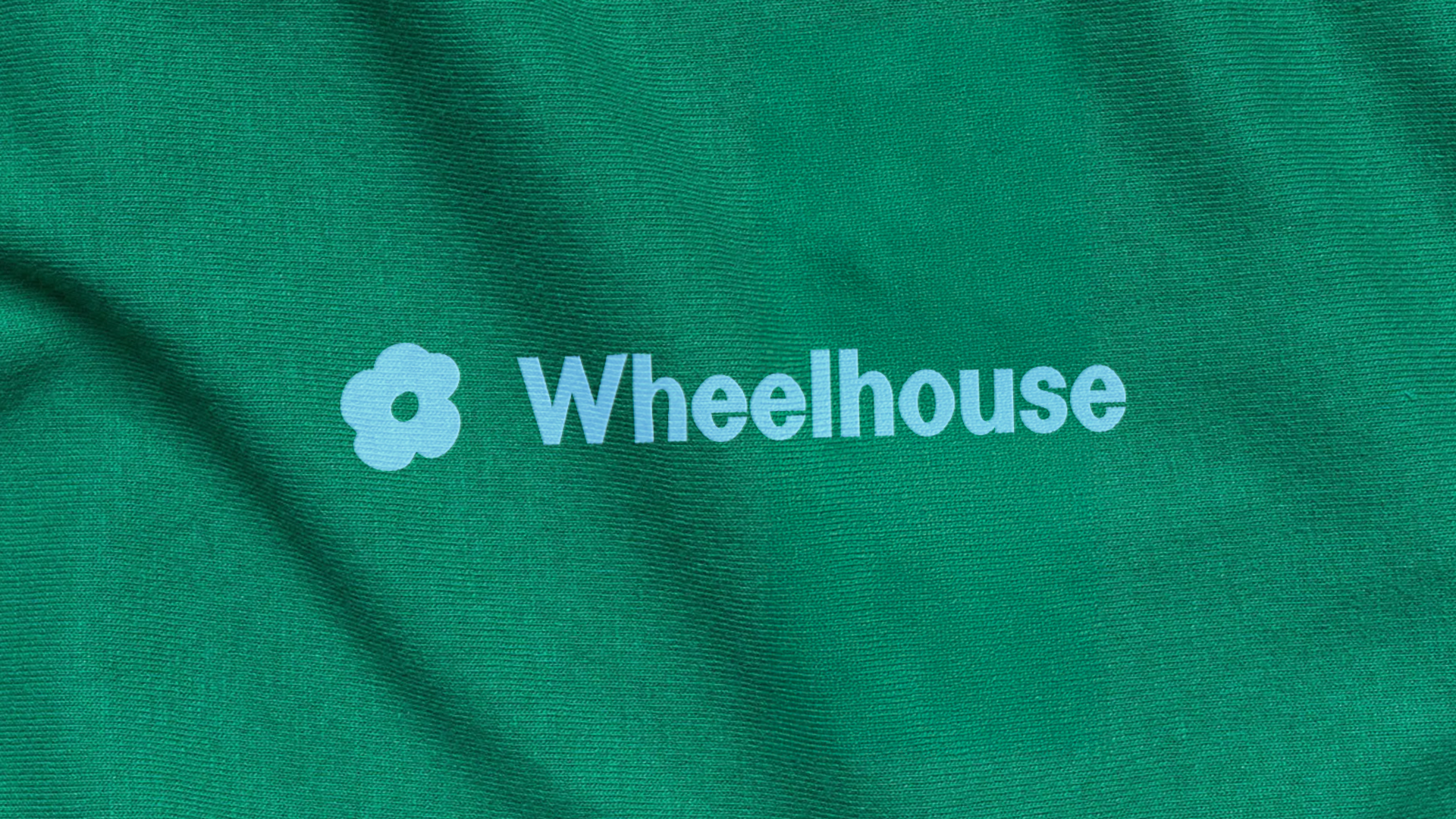 Wheelhouse Logo on Green Shirt